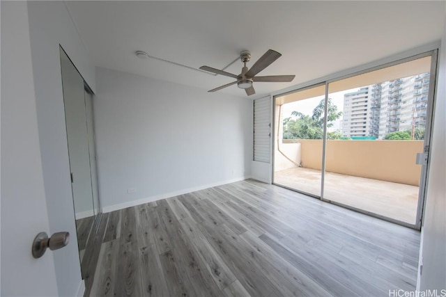 unfurnished bedroom with ceiling fan, light hardwood / wood-style floors, and a closet