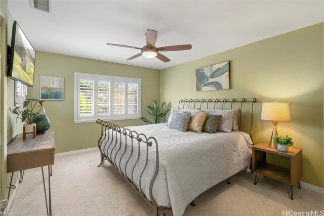 bedroom with light colored carpet and ceiling fan