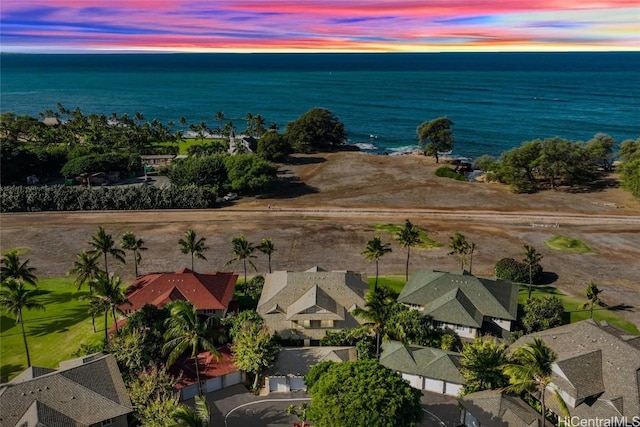 aerial view at dusk with a water view