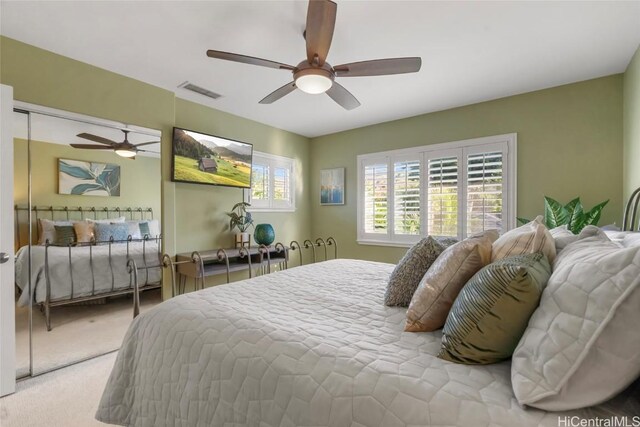 bedroom featuring ceiling fan and carpet