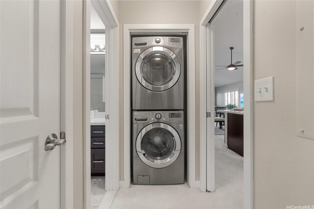 92-1001 Aliinui Dr Unit 25C, Kapolei, HI 96707 - laundry room featuring stacked washer and clothes dryer, light colored carpet, and ceiling fan
