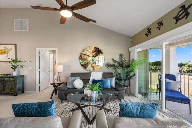 carpeted living room with high vaulted ceiling and ceiling fan