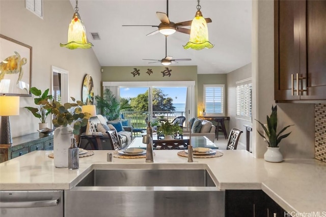 92-1001 Aliinui Dr Unit 25C, Kapolei, HI 96707 - kitchen featuring light countertops, visible vents, open floor plan, dark brown cabinets, and dishwasher