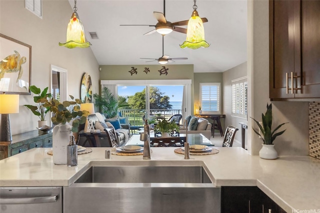 92-1001 Aliinui Dr Unit 25C, Kapolei, HI 96707 - kitchen with open floor plan, lofted ceiling, ceiling fan, light countertops, and decorative light fixtures