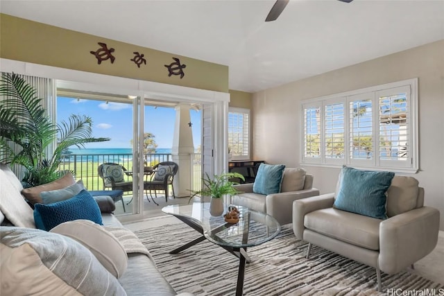 92-1001 Aliinui Dr Unit 25C, Kapolei, HI 96707 - living room with a water view, ceiling fan, and a wealth of natural light