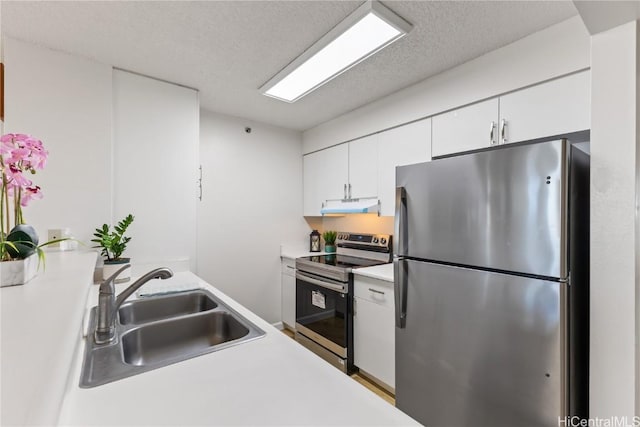 kitchen featuring sink, white cabinetry, appliances with stainless steel finishes, and a textured ceiling