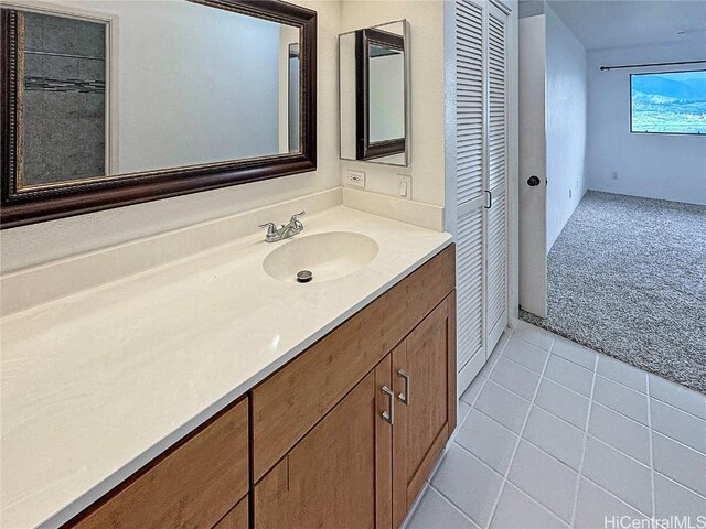 bathroom with tile patterned flooring and vanity