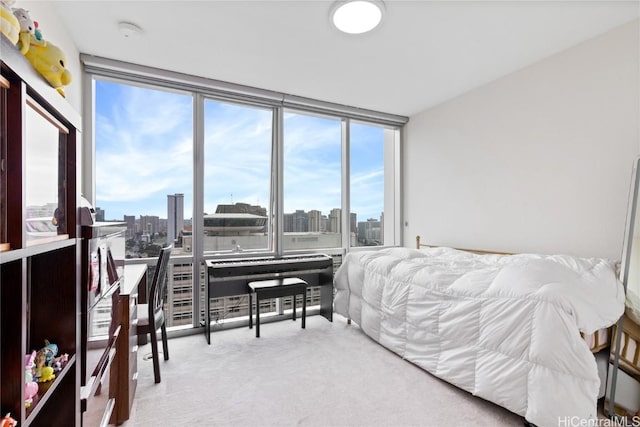 bedroom featuring light carpet and expansive windows