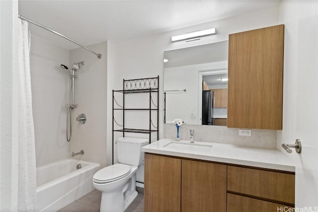 full bathroom featuring toilet, shower / bath combo, and vanity