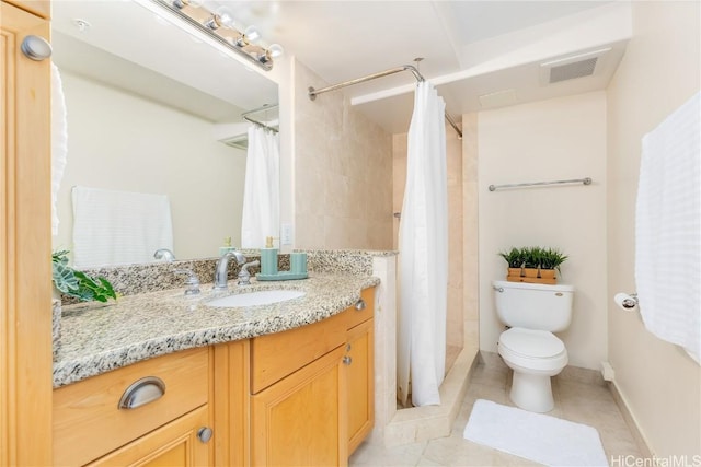 bathroom featuring toilet, vanity, walk in shower, and tile patterned flooring