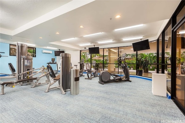 gym with floor to ceiling windows, carpet floors, and an AC wall unit