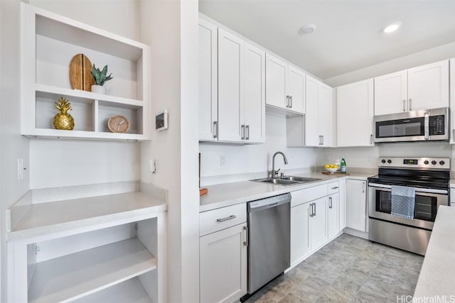 kitchen featuring white cabinetry and appliances with stainless steel finishes