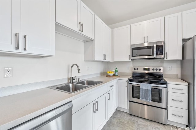 kitchen with white cabinetry, sink, and appliances with stainless steel finishes