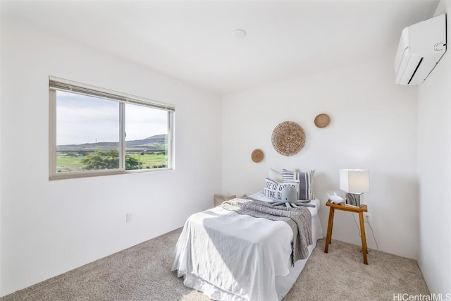 bedroom featuring light colored carpet and an AC wall unit