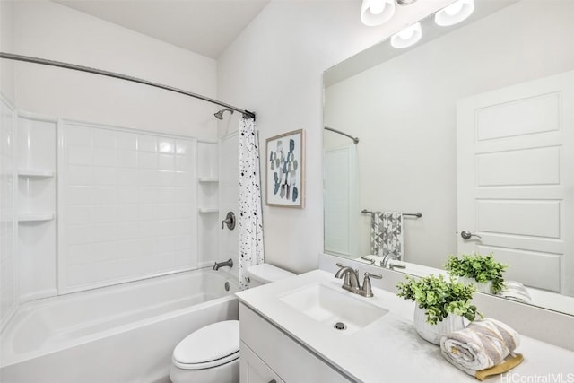 full bathroom with vanity, shower / bath combination with curtain, and toilet