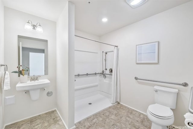 bathroom with a shower and toilet