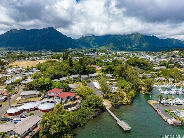 drone / aerial view with a water and mountain view