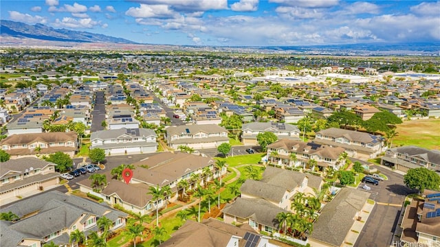 birds eye view of property with a mountain view