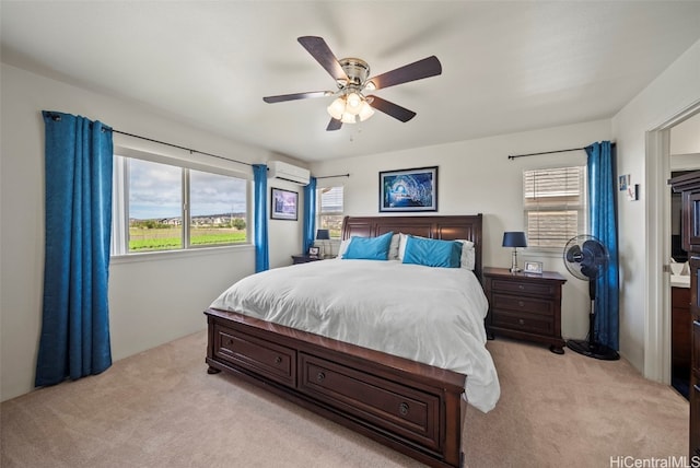 carpeted bedroom featuring an AC wall unit and ceiling fan