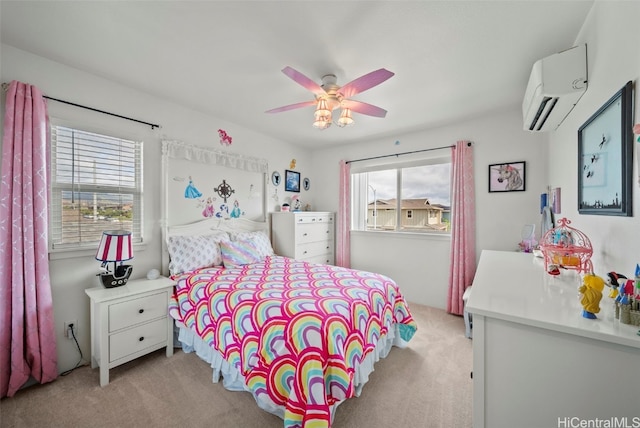 bedroom featuring light colored carpet, a wall unit AC, and ceiling fan