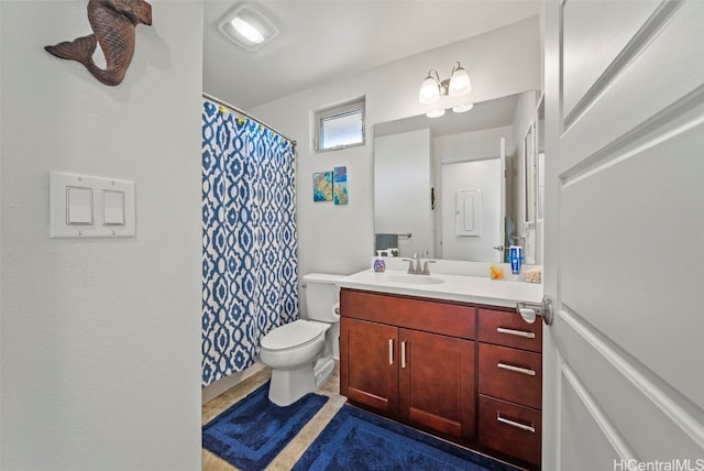 bathroom with vanity and toilet