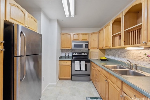 kitchen featuring backsplash, stainless steel appliances, sink, and light brown cabinets