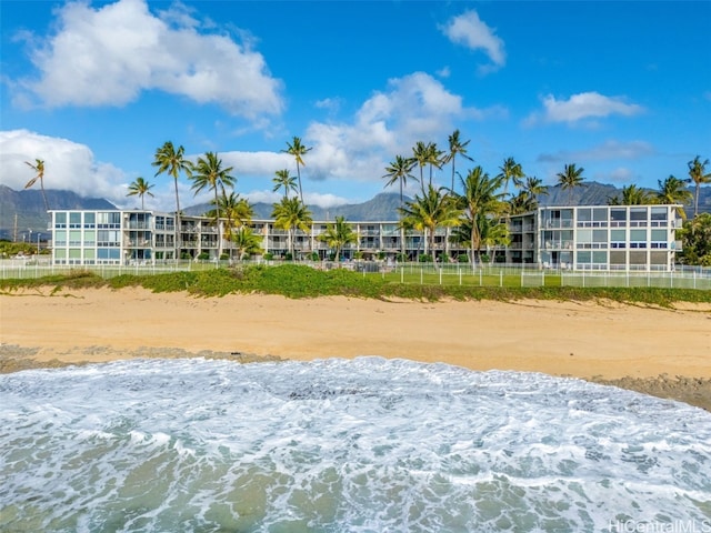 view of property's community featuring a water view and a view of the beach