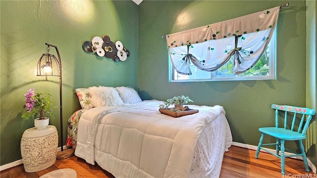 bedroom featuring wood-type flooring