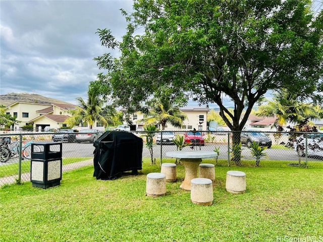 view of yard with fence and a residential view