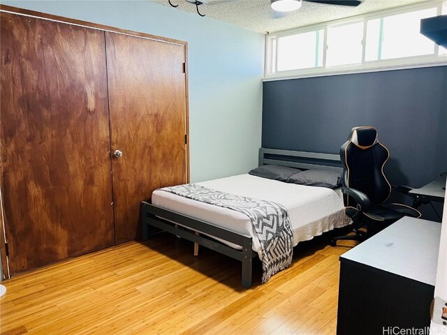 bedroom with a closet and light wood-style floors