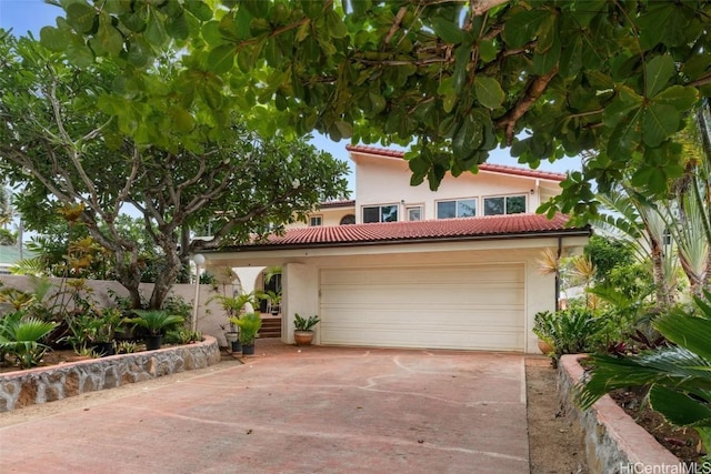 mediterranean / spanish-style house featuring a garage