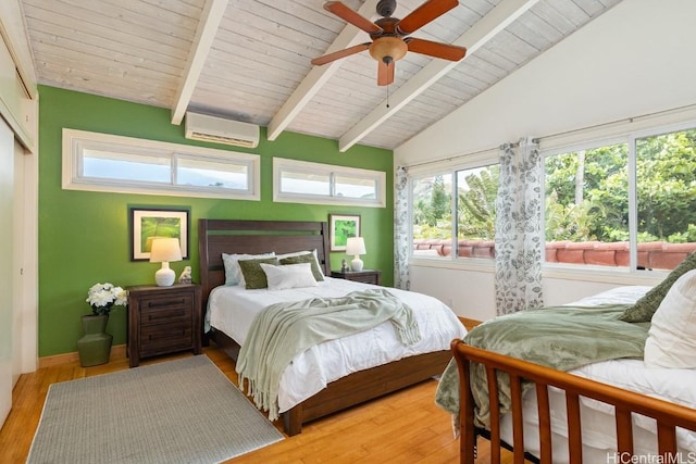 bedroom featuring ceiling fan, a wall mounted AC, light hardwood / wood-style floors, vaulted ceiling with beams, and wooden ceiling