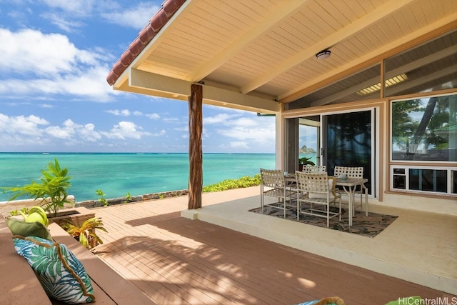 view of patio with a water view