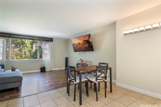 dining room with light tile patterned flooring