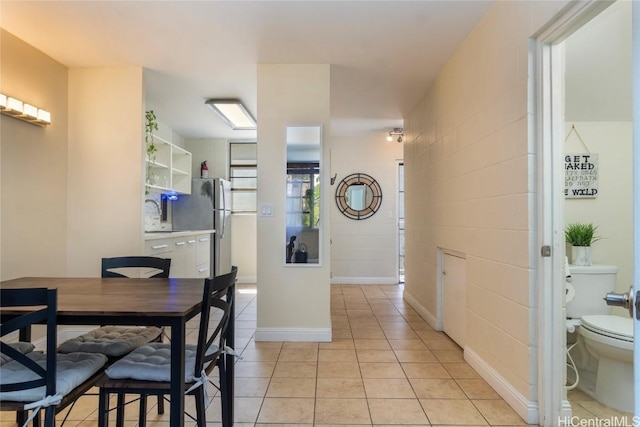 tiled dining area with sink