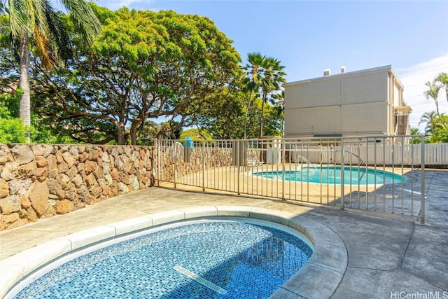 view of swimming pool featuring a patio