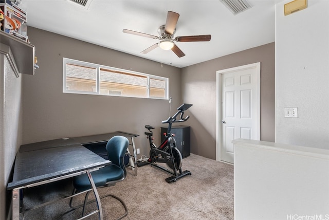 carpeted office featuring ceiling fan