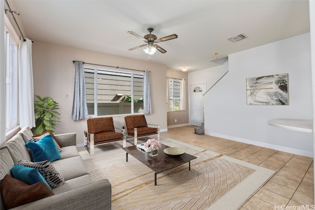 living room with ceiling fan and light tile patterned floors