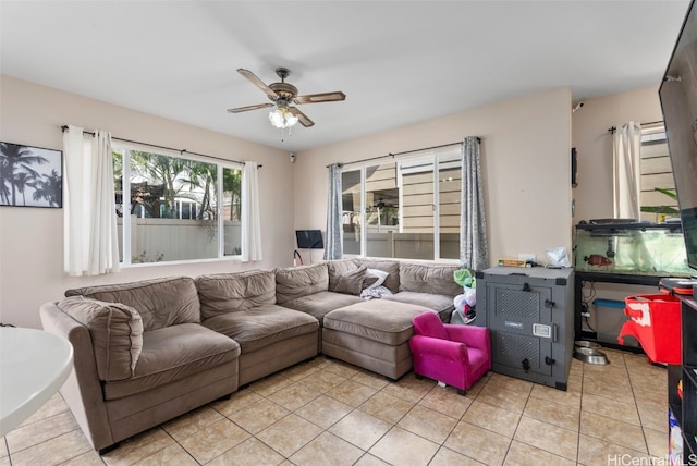 living room with ceiling fan and light tile patterned floors