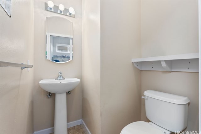 bathroom featuring sink and toilet