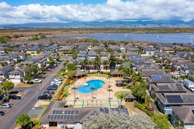 birds eye view of property featuring a water and mountain view