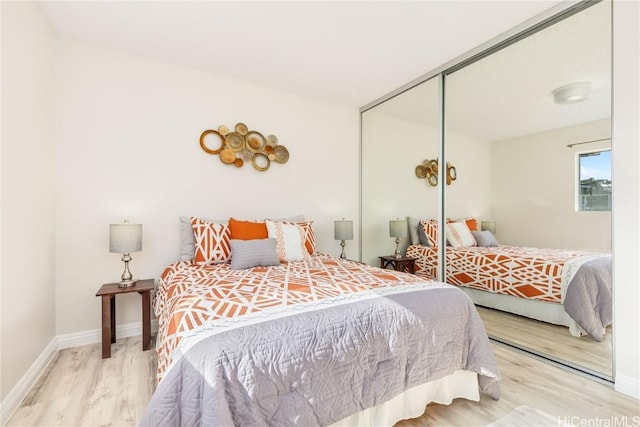 bedroom featuring a closet and hardwood / wood-style flooring