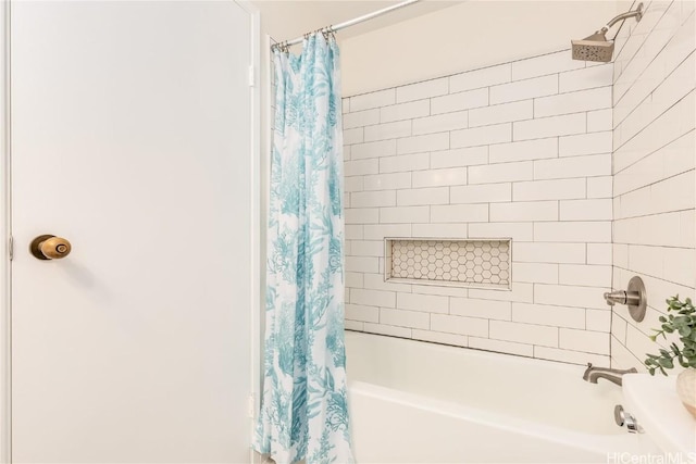 bathroom with shower / bathtub combination with curtain