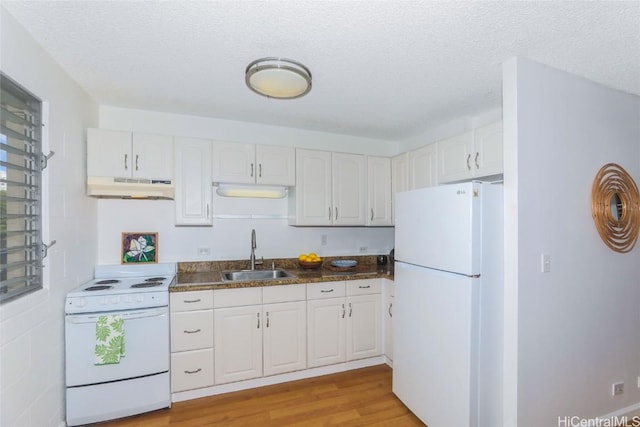 kitchen featuring white appliances, white cabinets, a textured ceiling, light hardwood / wood-style floors, and sink