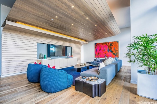 living room with wood finished floors, wood ceiling, and recessed lighting