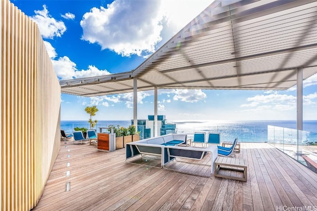 wooden deck featuring a water view