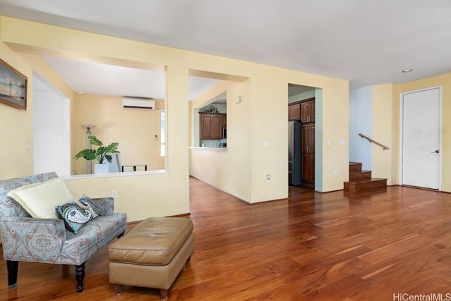 interior space featuring hardwood / wood-style floors and a wall unit AC