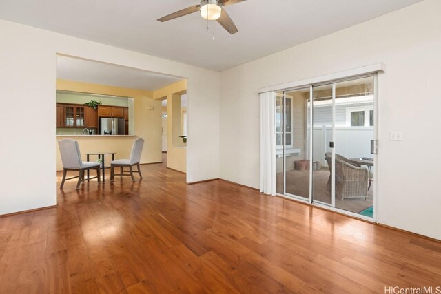 spare room featuring ceiling fan and hardwood / wood-style floors