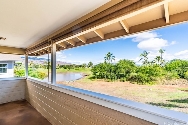 balcony featuring a water view