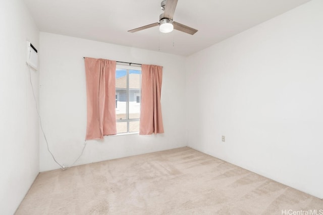 empty room featuring light carpet and ceiling fan